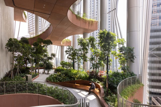 Green Oasis in CapitaSpring: modern biophilic space for corporate networking and retreats.