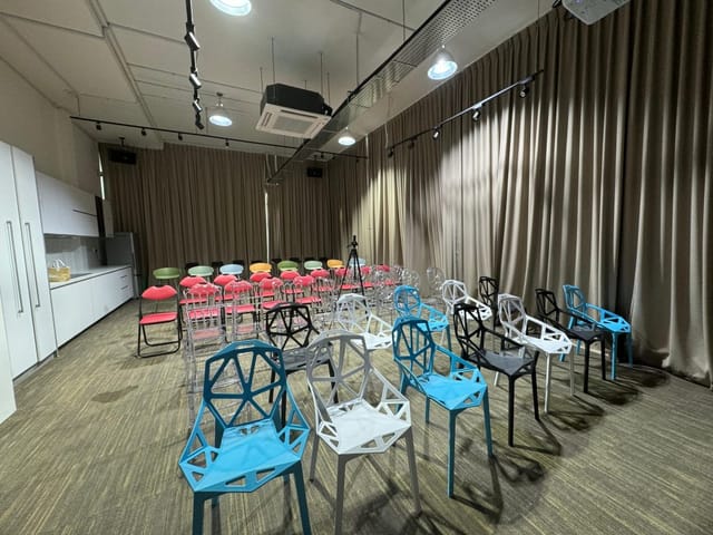 MIT Galaxy meeting space with theater-style seating for corporate workshops and events.