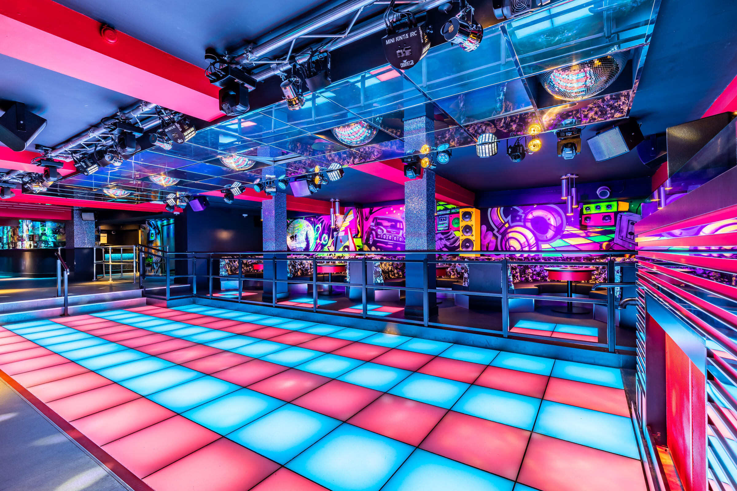 Neon-lit Vinyl Club dance floor for experiential product launches and corporate events. - Banner