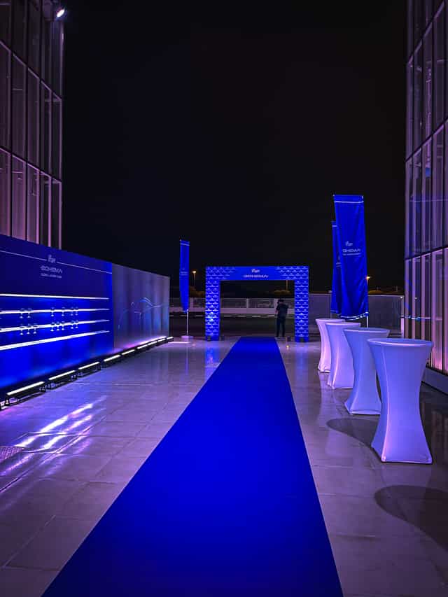 Space 01 venue at The Space: Blue carpet, branded architecture for corporate event networking.