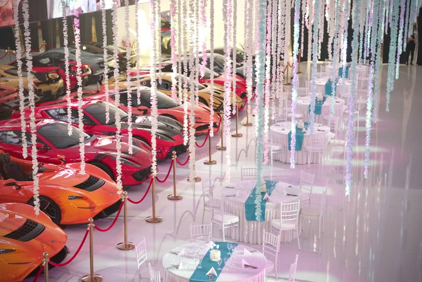 Luxury car display at Space 01 event venue with floral decor for gala or corporate banquet.