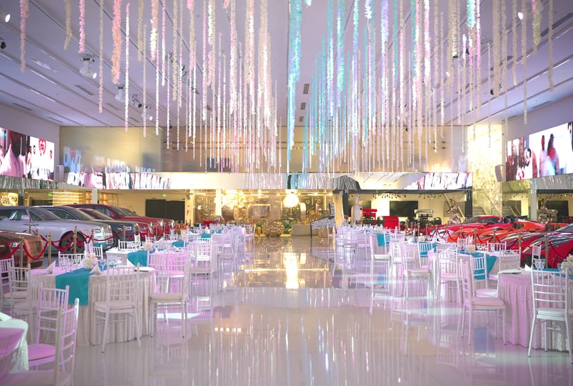 Luxury automotive display at Space 01 & 02 venue with dramatic lighting for corporate event staging.