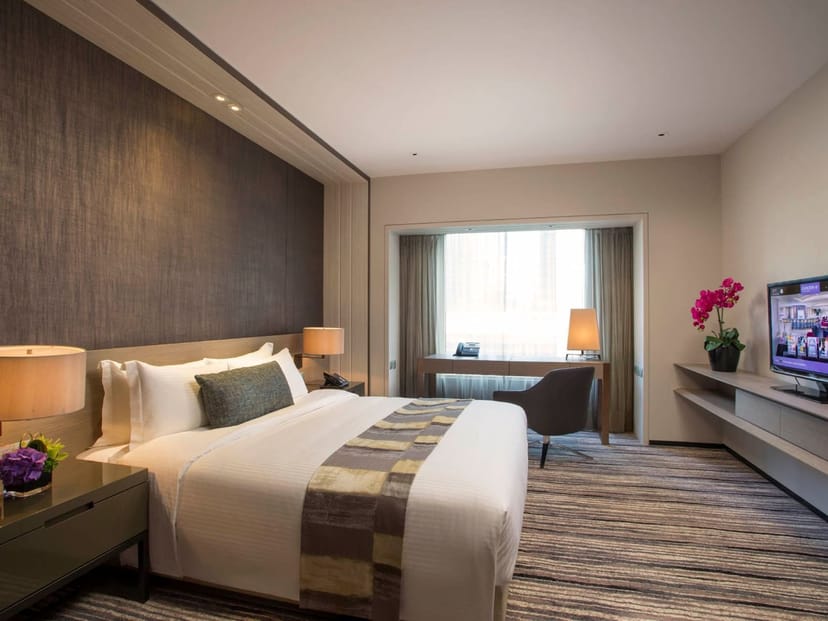 Crystal Club Premier Room with dedicated workspace for executive retreats and business travel.