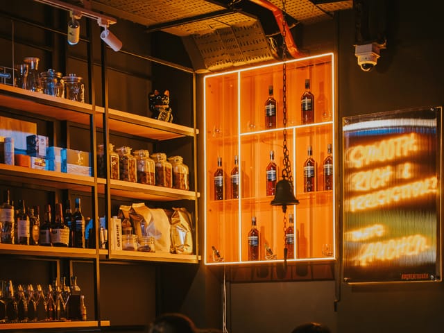 Highball cocktail in white shades, mood-lit bar setup for VIP event or corporate reception.