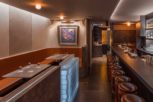 White Shades dessert bar: intimate VIP event space with warm lighting for networking and receptions.