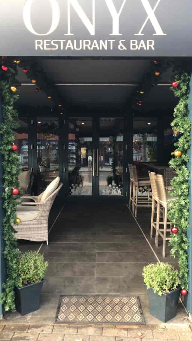 Onyx restaurant with festive decor for holiday parties and cozy reception events.