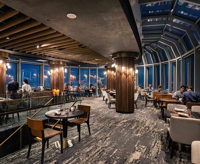 FLNT at 1-Atico: Elegant venue with panoramic city views for VIP corporate dinners and networking.