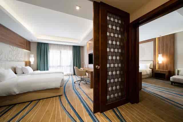 Modern connecting meeting suite at Radisson Blu Jeddah Al Hamra for VIP events and family stays.
