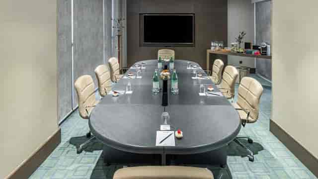 Boardroom meeting setup at Radisson Blu Jeddah Al Hamra with integrated AV for corporate events.