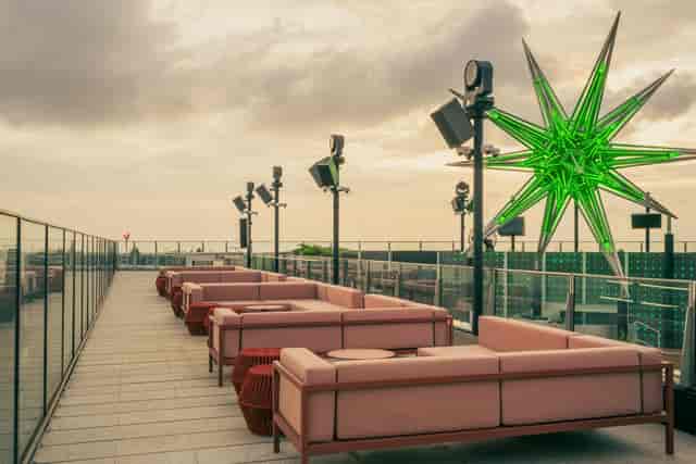 Modern NOVA rooftop bar with geometric decor, ideal for upscale evening receptions and brand events.