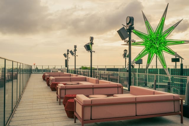 Modern NOVA rooftop bar with geometric decor, ideal for upscale evening receptions and brand events.
