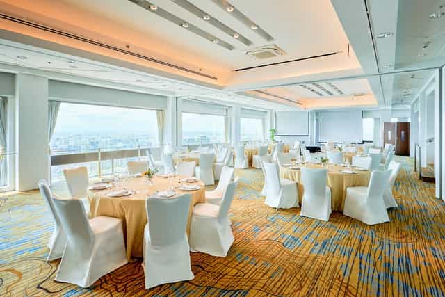 Elegant Stamford Ballroom with round tables, ideal for corporate meetings and formal banquets.