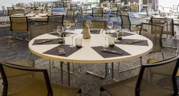 Jacobins-Celestins event space with round tables for professional corporate gala or conference.