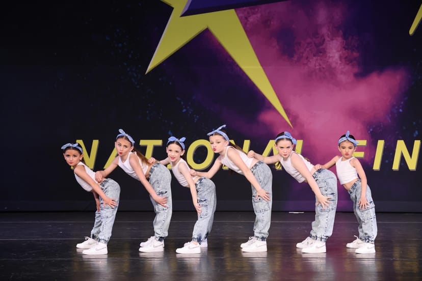 EPA dance studio youth competition with professional stage lighting and ensemble performance.