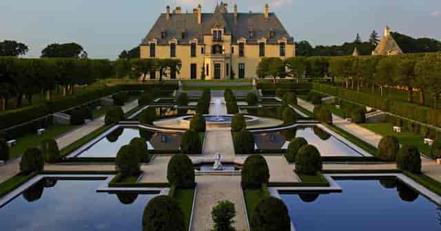 Oheka Castle Terrace Room: Luxury wedding and corporate retreat venue with manicured grounds.
