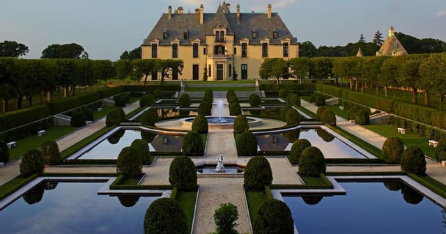 Oheka Castle Terrace Room: Luxury wedding and corporate retreat venue with manicured grounds.