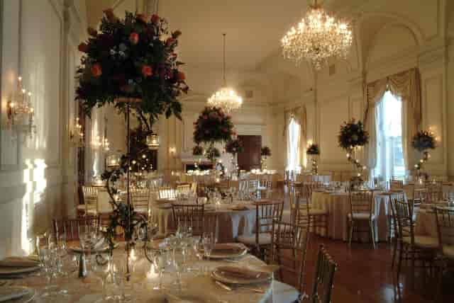 OHEKA CASTLE grand ballroom with tall floral centerpieces for elegant wedding gala.
