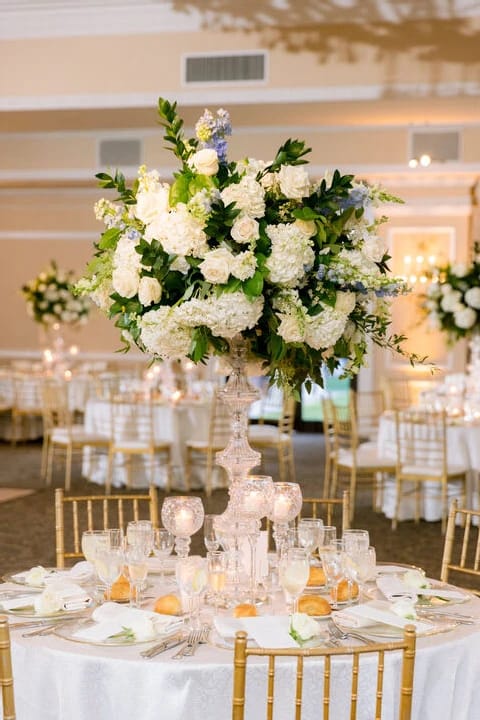 Oheka Castle gala tablescape with floral centerpiece for luxury weddings and corporate events.