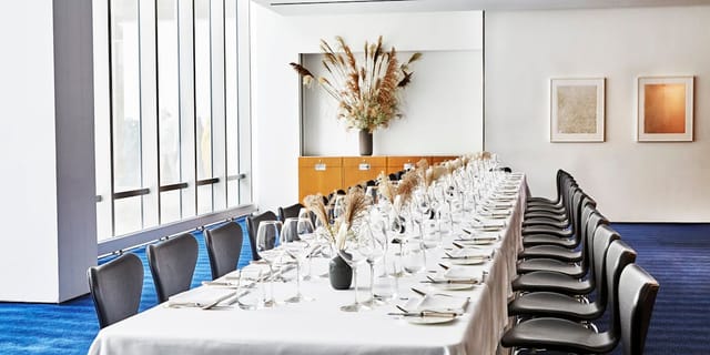 Boardroom dining setup in Private Dining Room 2 for intimate corporate VIP dinners.