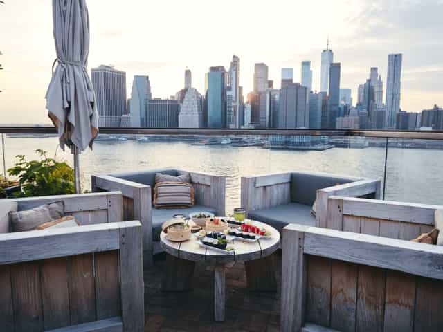 Saltgrass rooftop lounge with Manhattan skyline view for VIP networking and corporate cocktail events.