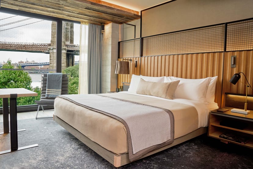 Luxury 1 Hotel Brooklyn Bridge screening room with iconic bridge view for VIP corporate events.