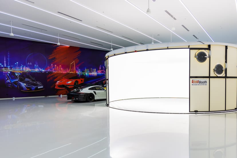 Luxury automotive-themed venue for product launches and brand activations with photo booth.