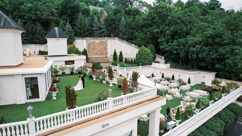 Villa Barone Manor garden with tiered banquet setup for outdoor wedding and event venue.
