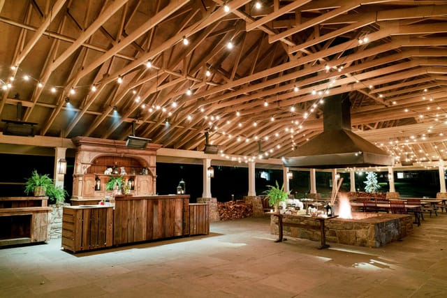 Rustic timber Pavilion at Cedar Lakes Estate with fire pit for corporate retreats and events.