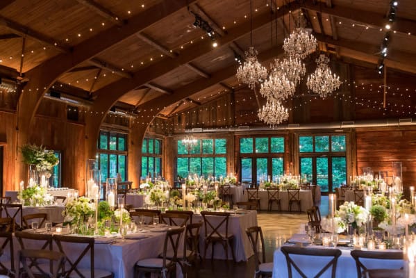 Rustic Treehouse conference room with crystal chandeliers for luxury corporate events or weddings.