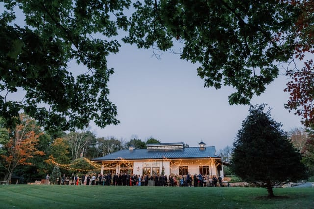 Golden hour bistro lighting at Cedar Lakes Estate Barn Patio for corporate and social events.