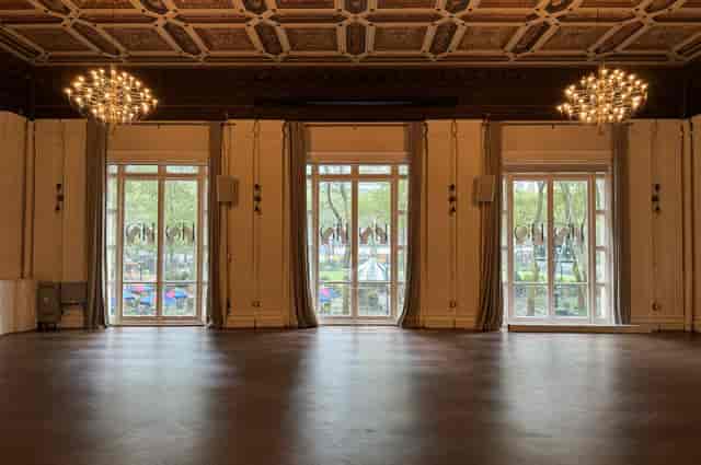 Ballroom event space with coffered ceilings for elegant gala and corporate reception venues.