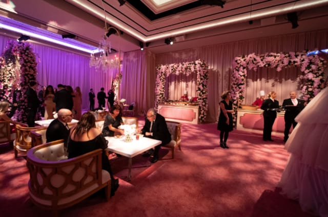 Ballroom event space with floral arches for luxury networking and corporate galas.