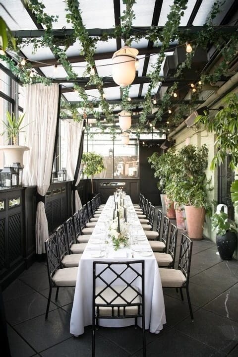 High-end Terrace venue with biophilic decor for corporate dinners and networking events.