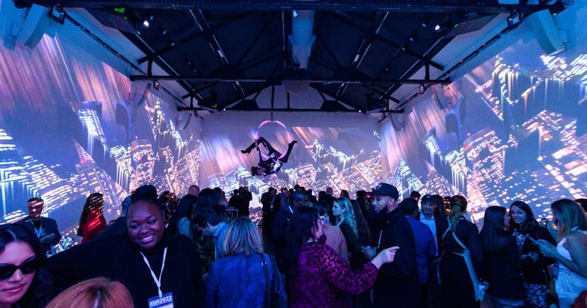 Immersive projection mapping and aerial entertainment at a Lavan Chelsea banquet hall event.