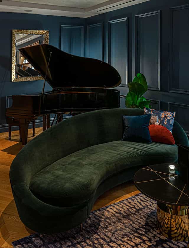The Wallace Lounge with grand piano for upscale VIP reception and corporate networking event.