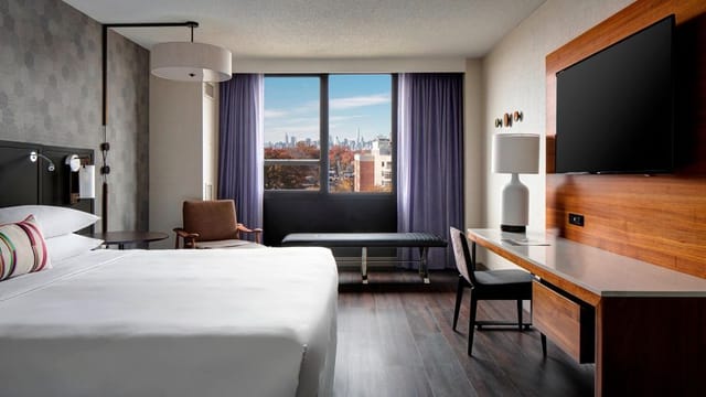 Modern guest room at New York LaGuardia Airport Marriott, ideal for business conference travel.