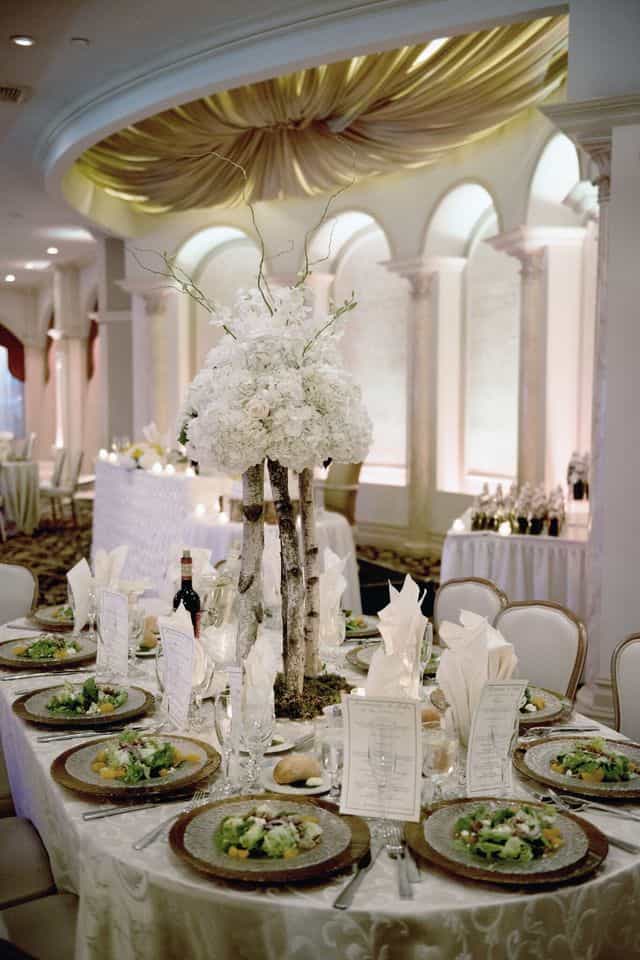 Luxury gala centerpiece with birch wood decor for upscale wedding event planning in Marina Del Rey.