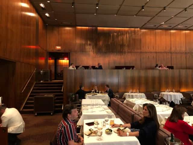 Luxury wood-paneled restaurant dining space for private board dinners and VIP networking events.