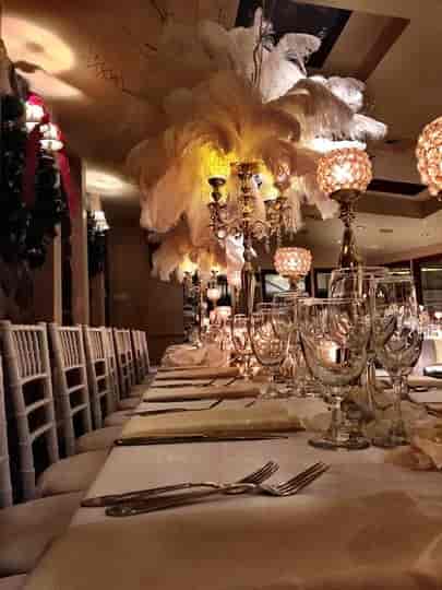 Elegant gala ballroom at The Stone House with crystal candelabras for formal events.