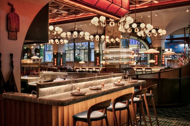 Chez Zou Manhattan West: upscale networking and VIP dinner venue with sophisticated tiered seating.