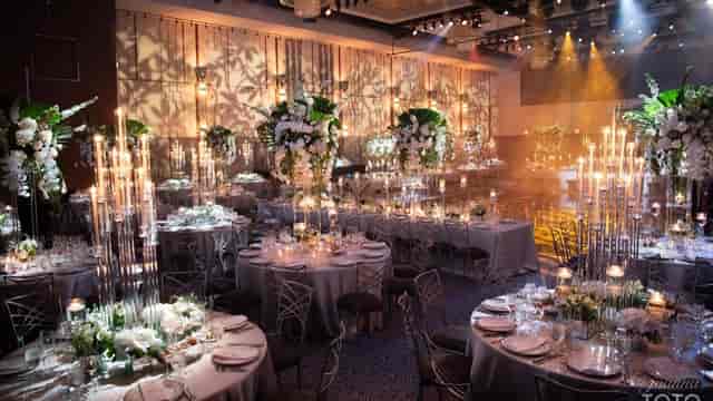 Ziegfeld Ballroom gala with oversized floral centerpieces for luxury corporate event planning.