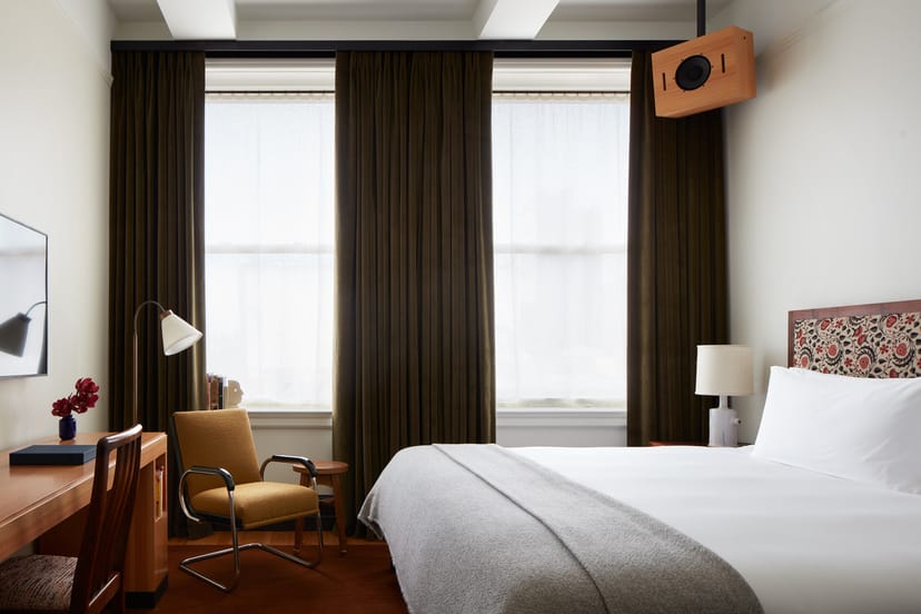 Nine Orchard suite with a functional workspace for corporate business travel.