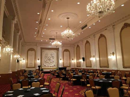Crystal Ballroom at The New Yorker Hotel with chandeliers for corporate gala and banquet events.