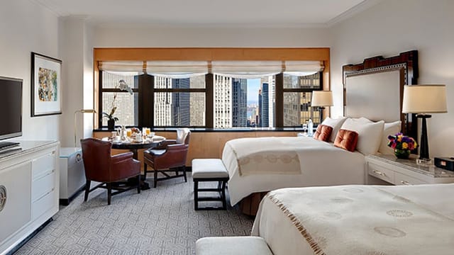 Luxury guest room at Lotte New York Palace for executive travel and corporate business meetings.