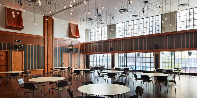 Ace Hotel New York boardroom with industrial chic decor for corporate meetings and workshops.