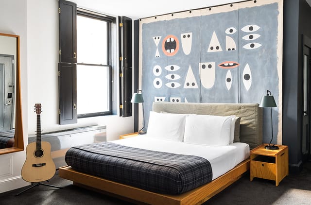 Ace Hotel New York boutique guestroom with statement art for brand activations and creative retreats.