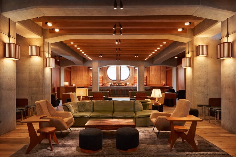 Gallery breakout space at Ace Hotel New York with upscale seating for executive retreats.