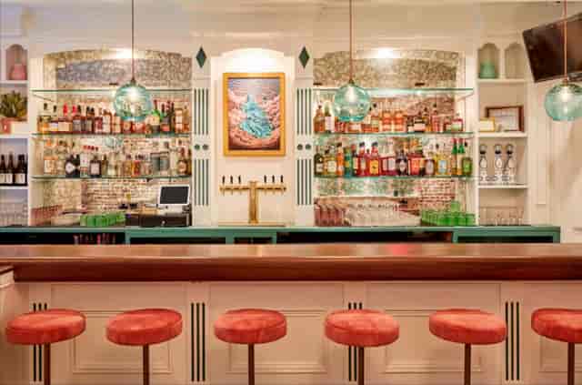 Upscale bar at All & Sundry, elegant counter for networking and cocktail reception events.