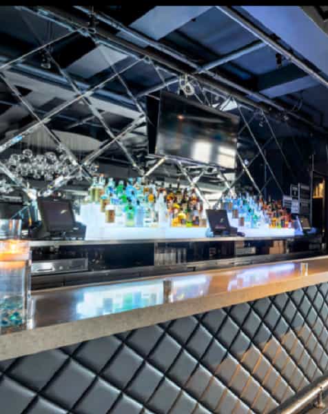 Sleek modern bar at The Hard Bar, ideal for cocktail receptions and networking events.