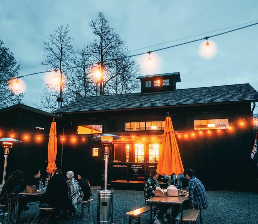 Al fresco terrace with string lighting for outdoor networking events and corporate receptions.